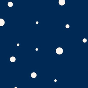 Small and big beige dots over navy blue