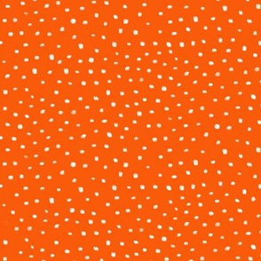 small white dots orange background