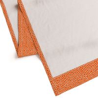 medium white dots orange background