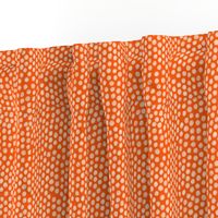 medium white dots orange background