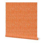 medium white dots orange background