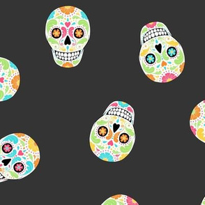 Scattered Calavera Sugar Skulls on black night - medium scale