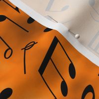 scattered music notes on orange