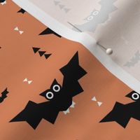 Cute little kawaii bat geometric triangles and halloween themed pumpkin orange kids design