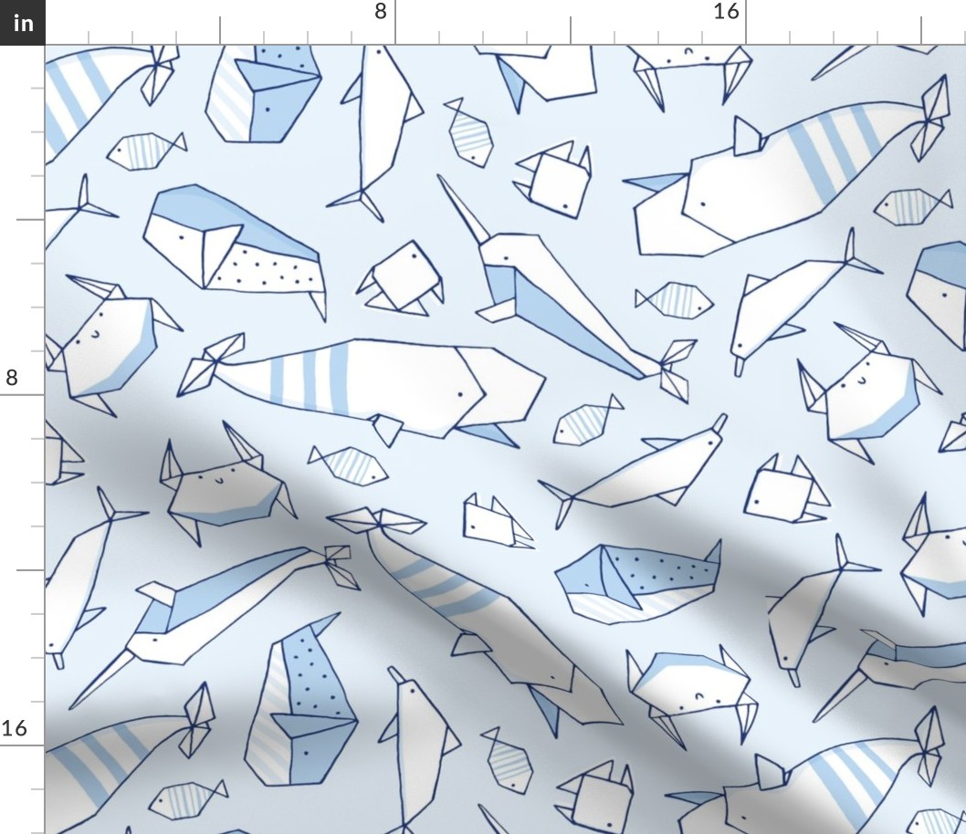 Origami whales in blue