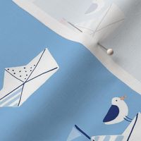 Paper boats in blue