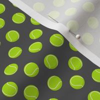 (extra small scale) tennis balls on dark grey