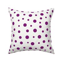 Purple dots of different sizes over beige background
