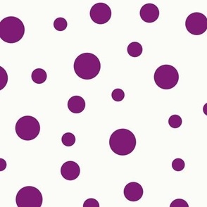 Purple dots of different sizes over beige background