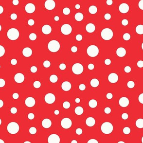 Beige dots of different sizes over red background seamless pattern