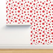 Red dots confetti over beige background