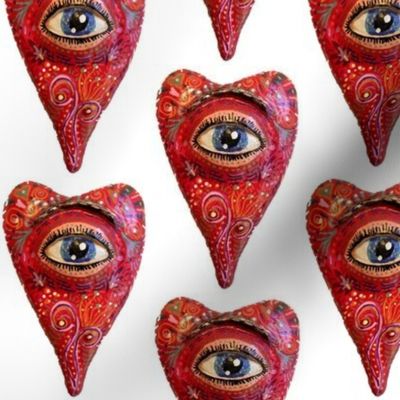 folk art heart with eye, white red blue