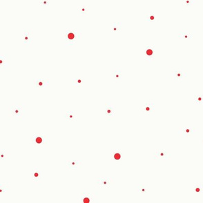 Red dots of different sizes over beige background seamless pattern