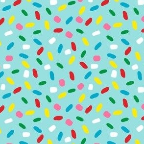 Sweet glazed, with colorful sprinkles on blue melting icing seamless pattern