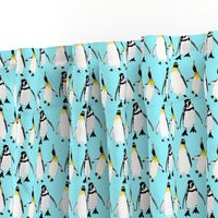 3 penguins on light blue