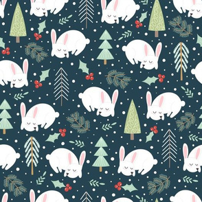 Winter rabbit in the forest with Christmas trees