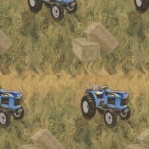 Blue tractor in hay field
