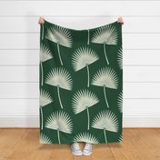 Boho sunshine palm leaves on forest green