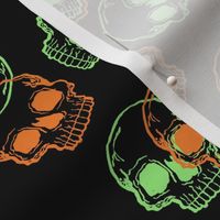 Orange and Green Skulls on Black