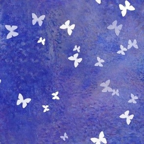 Tiny white butterflies on puple and blue