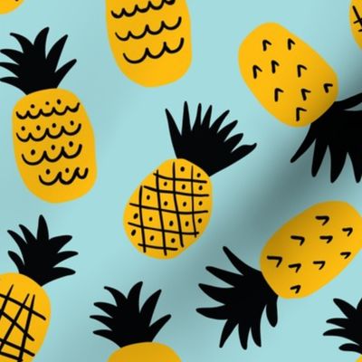 Cute hand drawn pineapples on light-blue background