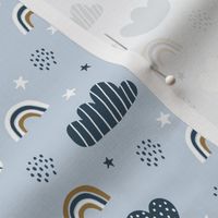 Sky, clouds, rainbows, stars on blue background. Scandinavian design