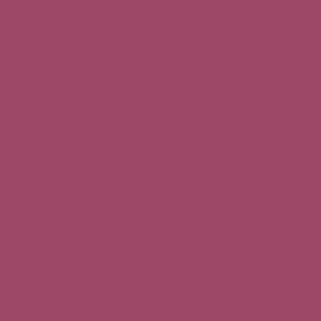 solid  faded raspberry red (#9C4866)