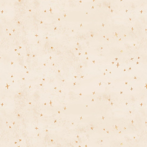 Scattered gold metallic look celestial stars on warm cream texture