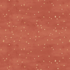 Scattered gold metallic look stars on rust red texture