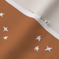 white scattered stars on copper