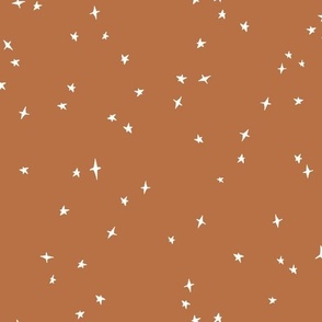 white scattered stars on copper