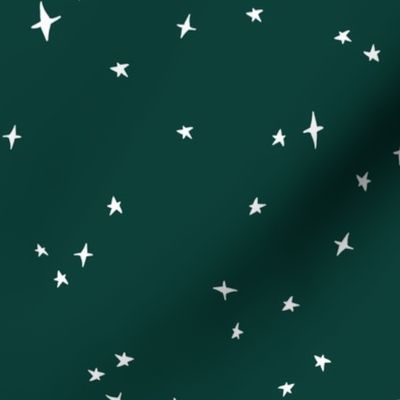 white scattered stars on fir green