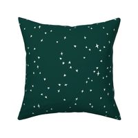 white scattered stars on fir green
