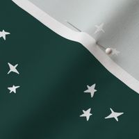 white scattered stars on fir green