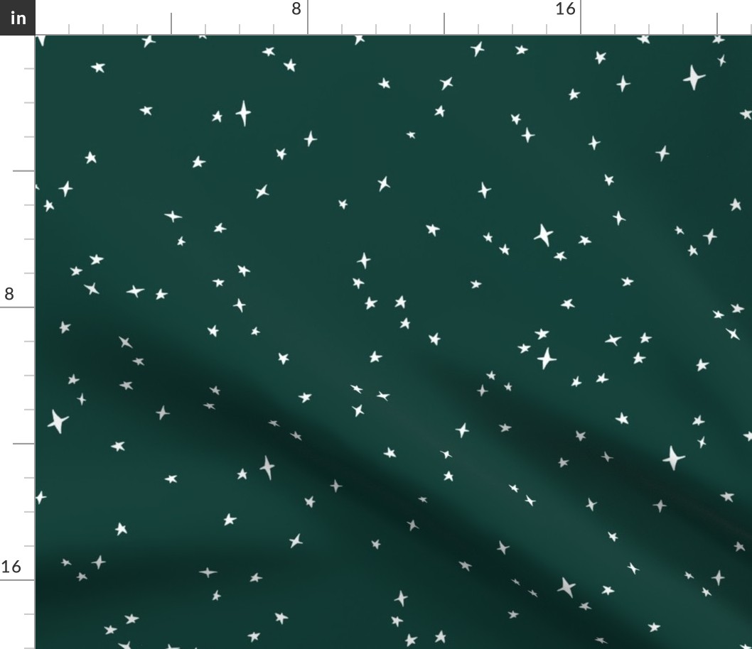 white scattered stars on fir green