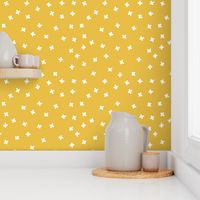 Geometric white cross stars on mustard yellow