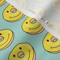 smiley face donuts on teal