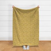 Abstract spots and dots abstract animal print trend design black and white ochre yellow