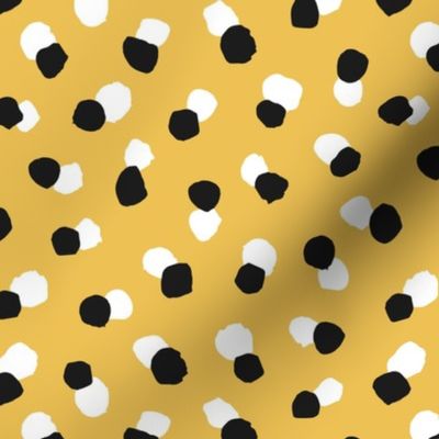 Abstract spots and dots abstract animal print trend design black and white ochre yellow