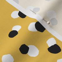 Abstract spots and dots abstract animal print trend design black and white ochre yellow