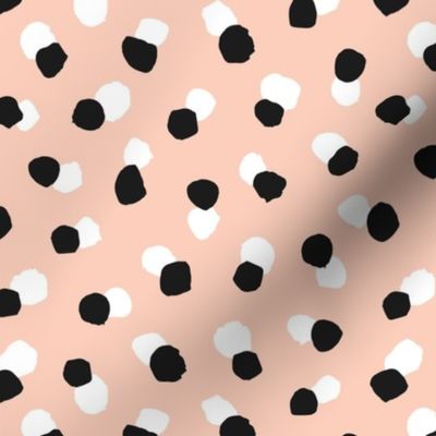 Abstract spots and dots abstract animal print trend design black and white apricot blush