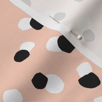 Abstract spots and dots abstract animal print trend design black and white apricot blush