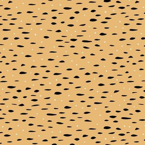 Minimal animal print inspired texture ink design trend spots and speckles honey yellow