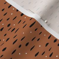 Minimal animal print inspired texture ink design trend spots and speckles rust copper brown
