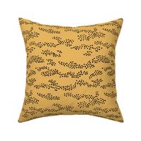 Minimal animal print snake skin inspired texture ink design trend spots and speckles abstract ochre yellow