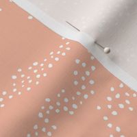 Minimal animal print snake skin inspired texture ink design trend spots and speckles abstract soft baby nursery peach