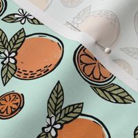 oranges  linocut fabric - oranges woodcut, orange, orange fabric, citrus, fruits fabric, citrus fruit fabric, orange fabric - light mint