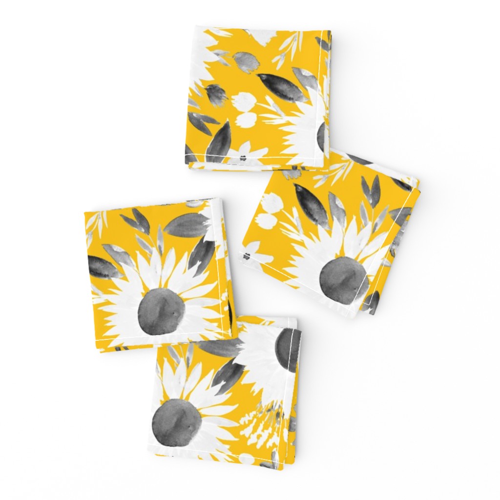 white and black sunflowers on mustard