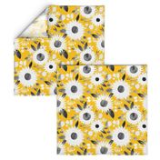 white and black sunflowers on mustard