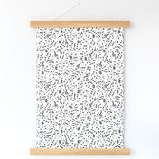 small scale scattered music notes black on solid white